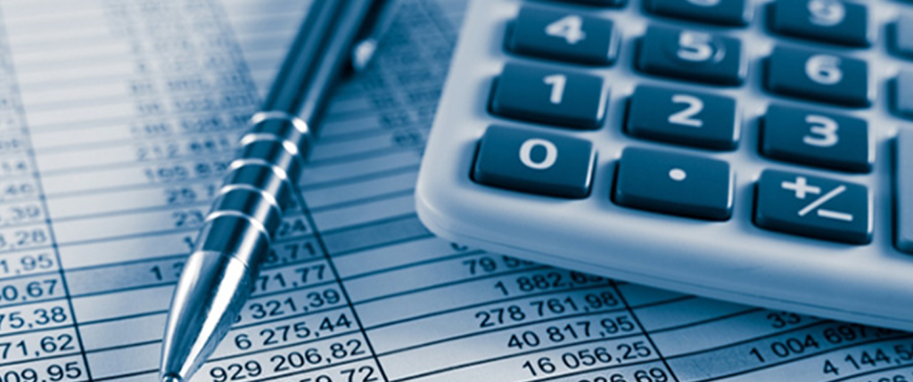 calculator and pen on spreadsheet