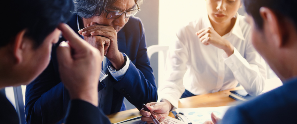 group of business people around a table
