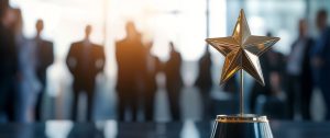 Gold star trophy on a pedestal with a blurred conference-room crowd in the background, symbolizing achievement in a corporate setting.