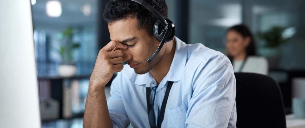 Frustrated Recruiter - Randall Reilly - Randall Reilly stressed and frustrated recruiter on a headset during a recruiting call