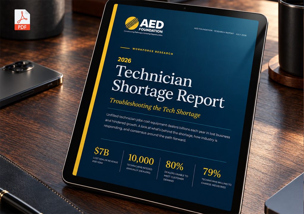 Tablet on a desk displaying the 2026 Technician Shortage Report by AED Foundation with a blue cover and yellow stripe along the edge.